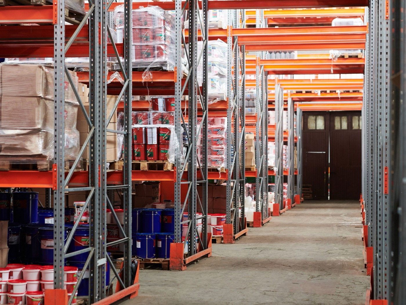 Racked and palletised stock inside a secured warehouse