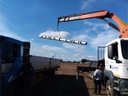 Crane-assisted offloading of street lighting columns