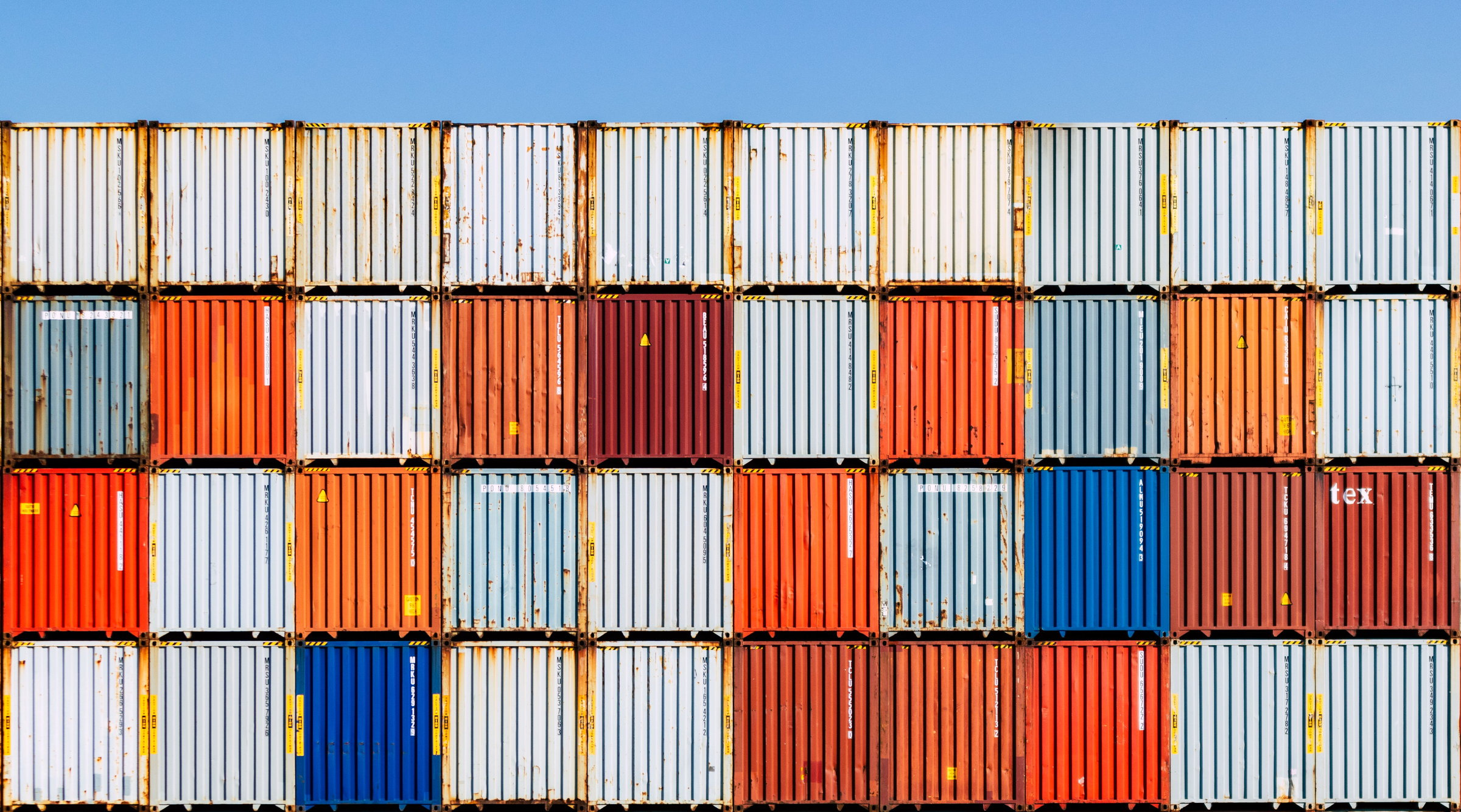 Stacked shipping containers at a port terminal